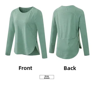 Dettaglio maglia yoga grigio-verde con maniche raglan e orlo curvo con spacco