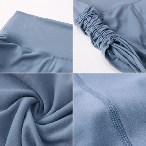 Detail view of high waist yoga shorts featuring side drawstring and fine stitching