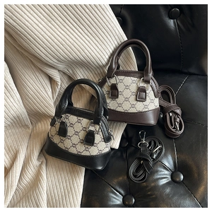 Detailed view of mini shell handbags in black and brown with geometric pattern
