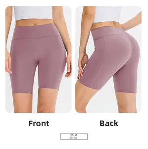 Detailed front and back views of dusty pink high-waisted yoga shorts with side pockets