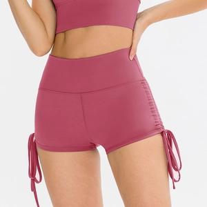 High-waist dusty pink yoga shorts with side drawstrings and matching sports vest