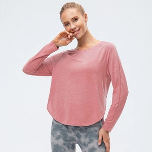T-shirt sport femme manches longues rose corail, coupe ample, séchage rapide et ourlet arrondi