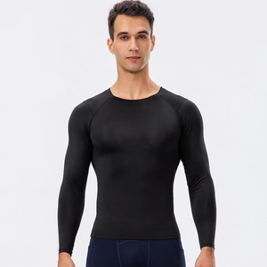 Haut de compression homme manches longues noir en tissu élastique à séchage rapide
