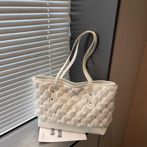 White plush patchwork tote bag with faux fur texture and elegant gold rivet details