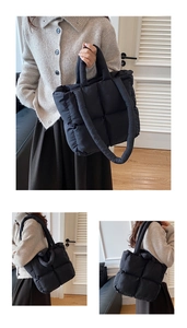 Detail of black quilted down puffer tote bag with large square stitching and soft handles