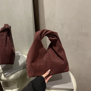 Minimalist burgundy leopard print handbag with a twisted handle and ruched design