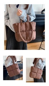 Close-up of deep brown quilted tote bag showing soft padded nylon fabric and large capacity