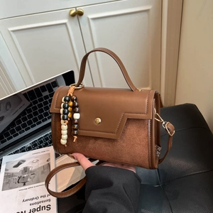 Retro patchwork brown handbag with suede panels and bohemian bead pendant for women