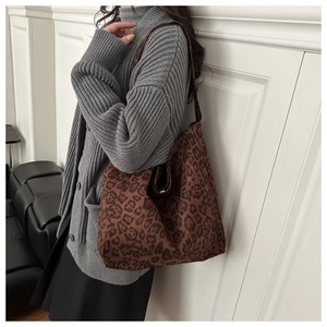 Leopard print tote bag shown on model highlighting the large capacity and stylish texture