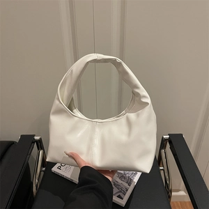 Minimalist white crescent shoulder bag with a modern solid color design and sleek finish