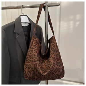 Close-up of leopard print canvas tote bag showing high-quality texture and pattern details