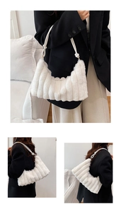 Detail of white plush shoulder bag featuring soft faux fur texture and knotted strap design