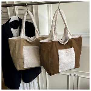 Detail of minimalist tote bags with khaki faux suede and white sherpa fleece trim