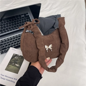 Brown suede crescent bag with silver butterfly metal detail and ruched wide shoulder strap