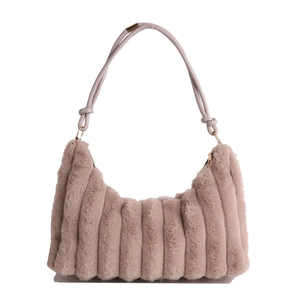 Winter plush baguette bag in pink faux fur with vertical stripe texture and knotted strap