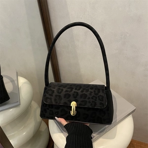 Minimalist black leopard print shoulder bag with suede texture and gold metal lock