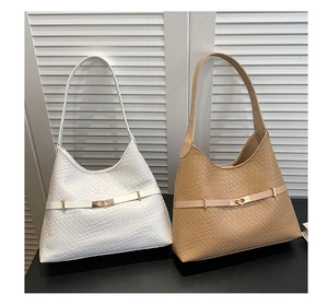 Detail of woven hobo shoulder bags in white and camel with metallic buckle