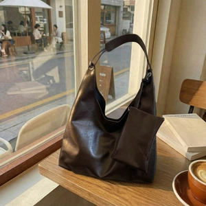 Large dark brown hobo tote bag in soft leather texture for stylish women's winter commute