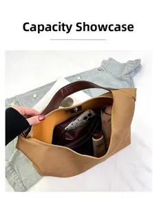 Top view of spacious tan canvas tote bag showing interior storage and zipper pocket