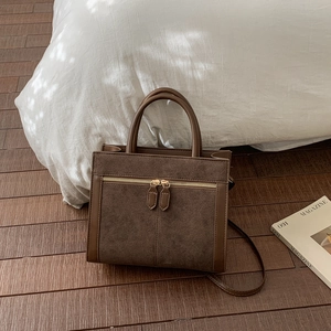 Retro brown suede crossbody handbag with dual metal zippers and leather patchwork design