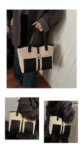Detail view of contrast tote bag with canvas body, leather pockets, and gold lock buckle