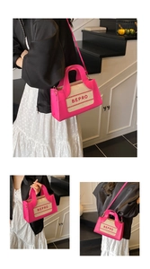 Close-up of the magenta and beige square handbag with printed BEPRO lettering