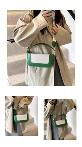 Detail of trendy color-block crossbody bag featuring green leather and woven fabric texture