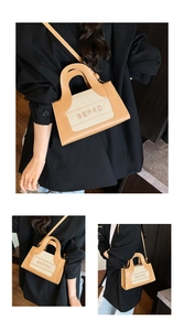 Detail of retro BEPRO crossbody bag featuring brown leather and beige woven fabric
