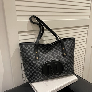 Large capacity monogram tote bag with embossed M logo and elegant gold rivet details