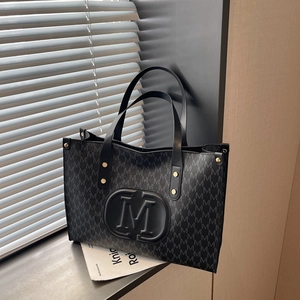 Large black tote bag with M-letter jacquard pattern and embossed logo for commuting