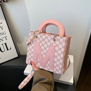 Pink faux leather tote bag with M-letter print and adjustable shoulder strap
