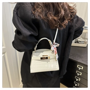 Classic white crocodile texture handbag with decorative silk scarf on the top handle