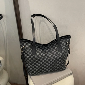 Large black tote bag with gray M-pattern jacquard print and leather straps