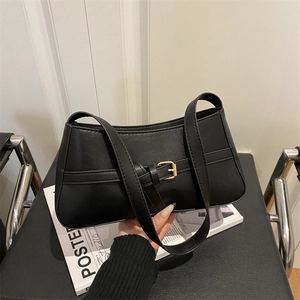 Minimalist black faux leather shoulder bag with gold buckle and stylish strap detail