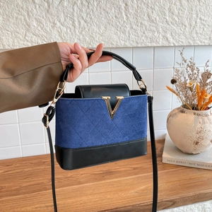 Quilted navy suede and black leather handbag with gold V-logo and long strap