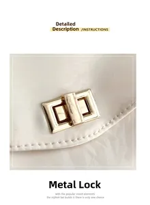 Macro shot of the rectangular golden metal hardware lock on a white textured tote bag