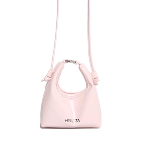 Chic pink mini crossbody bag with metal ring handles and HYLLZZA logo on white background
