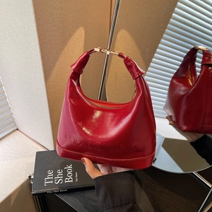 Glossy red hobo handbag with maisonhe embossing and gold metal buckle strap