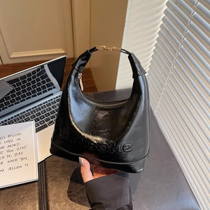 Glossy black leather half-moon bucket bag with embossed logo and gold buckle detail