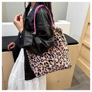 Detail of pink leopard print faux fur tote bag with bright pink braided rope handles
