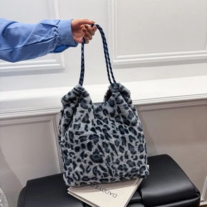 Faux fur leopard print tote bag with woven rope handles for a stylish winter look