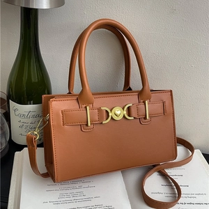Chic brown synthetic leather satchel with golden heart buckle and dual top handles