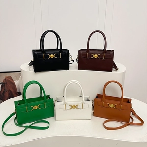 Minimalist square tote bags with heart buckle in five trendy colors on a display stand