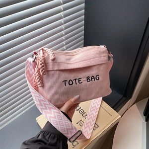 Pink corduroy tote bag with embroidered letters and geometric pattern wide shoulder strap