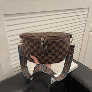 Vintage crescent crossbody bag with brown monogram leather and ethnic patterned strap