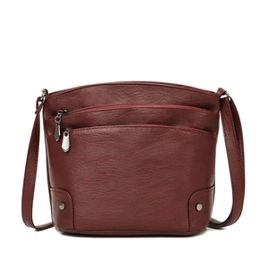 Classic deep red multi-layer leather bucket bag with silver zippers and crossbody strap
