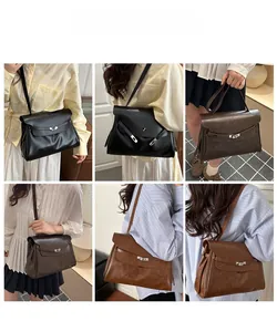 Classic faux leather tote featuring a metal turn-lock and adjustable shoulder strap style