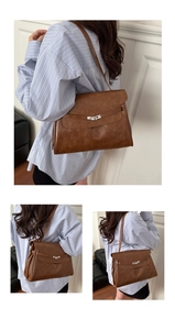 Detailed view of vintage brown leather tote featuring silver twist lock and retro texture