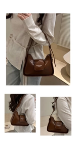 Close-up of dark brown leather baguette bag with 'FASHION & BAGS' text and adjustable strap