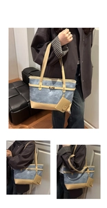 Detail of blue canvas tote bag with beige leather trim and vintage metal turn-lock closure